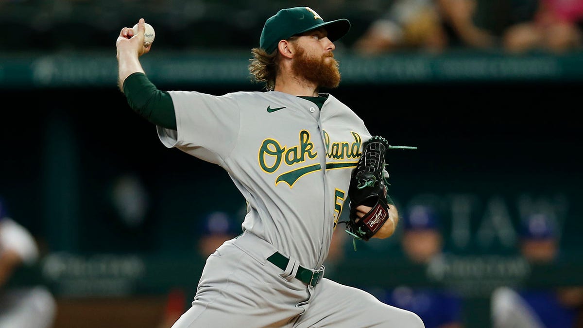 Paul Blackburn #58 of the Oakland Athletics throws a pitch in the first inning against the Texas Rangers at Globe Life Field on July 13, 2022 in Arlington, Texas. 
