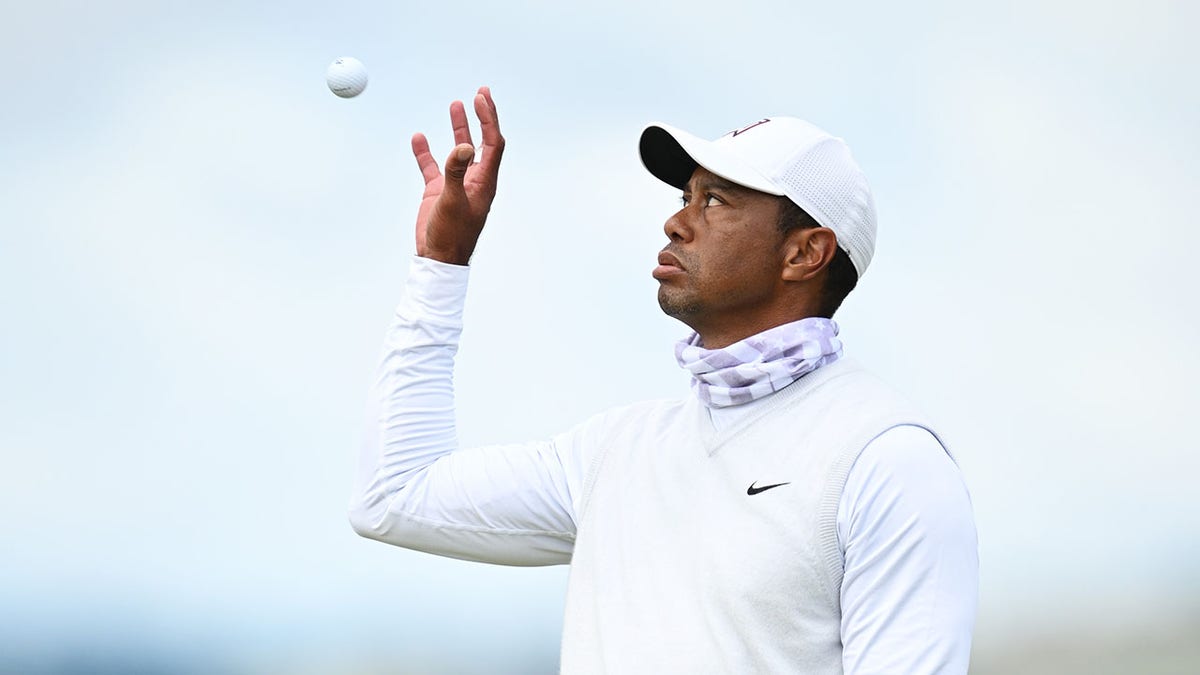 Tiger Woods on day two at the Open Championship catches a golf ball