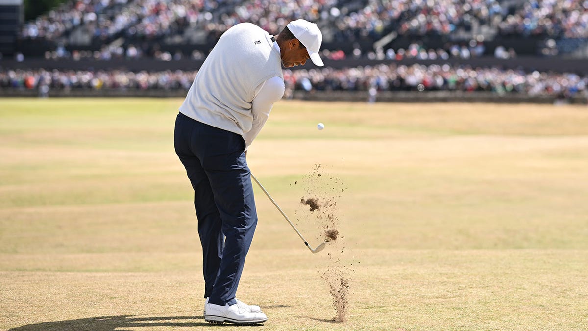 Tiger Woods attempts a shot at St. Andrews Old Course