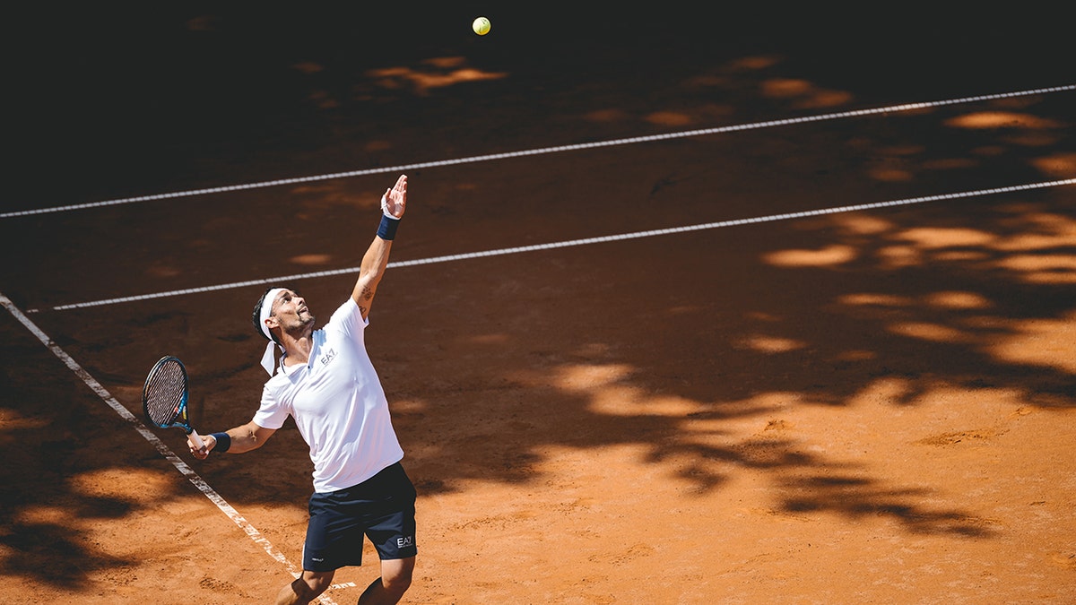 Fabio Fognini serves the ball