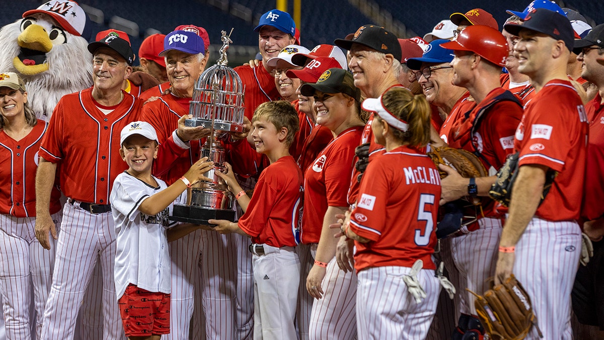 Several players celebrating with a trophy