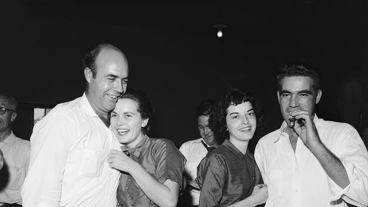 Roy Bryant, Carolyn Bryant and J.W. Milam celebrate after Roy Bryant and Milam were acquitted in the murder of Emmett Till