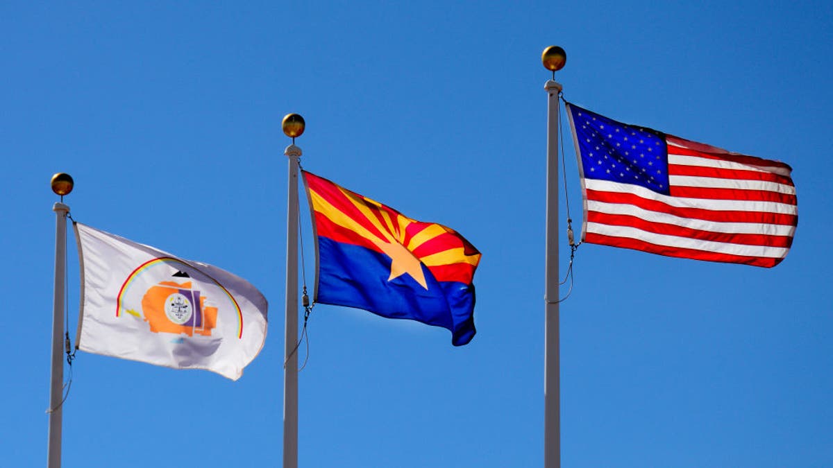 Arizona state flag, United States flag, and Navajo Nation flag