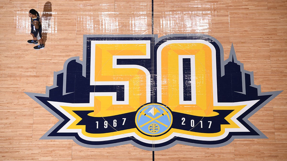 The Denver Nuggets logo on the floor in 2018 