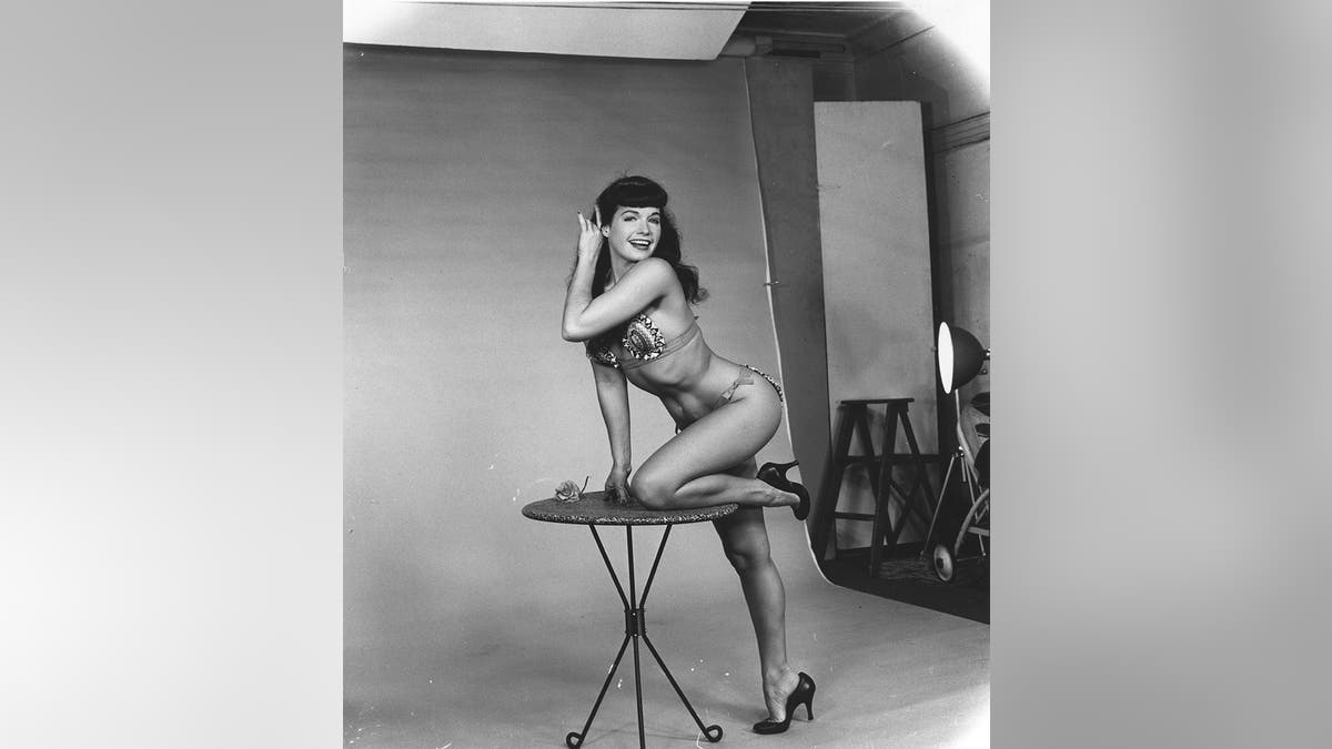 Bettie Page pinup - risque/cheeky - 1950's - reprint - multiple
