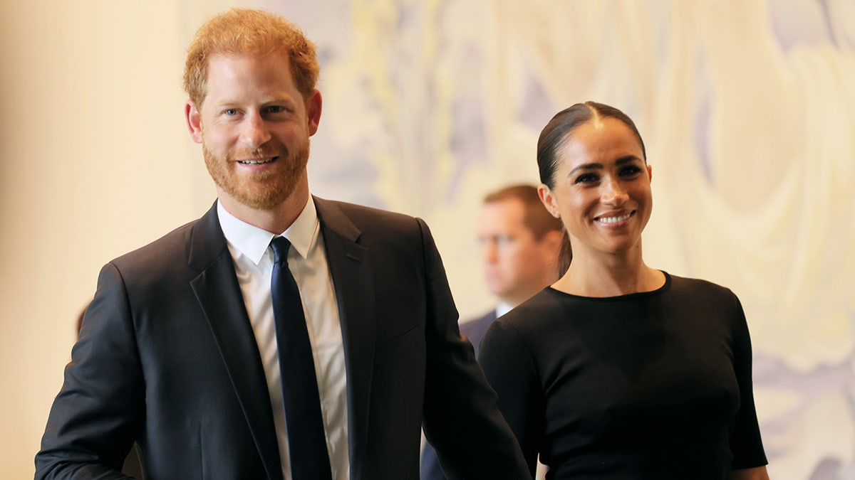 Prince Harry and Meghan Markle smiling