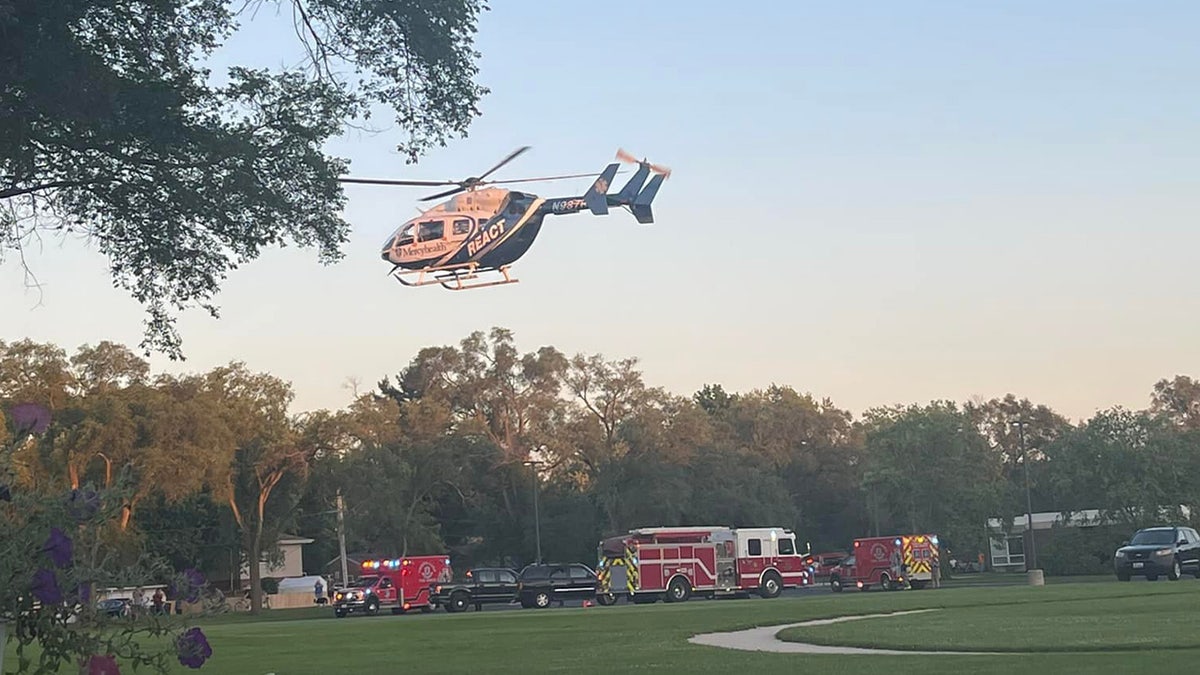 A medical helicopter transports patients from the scene of a car crash