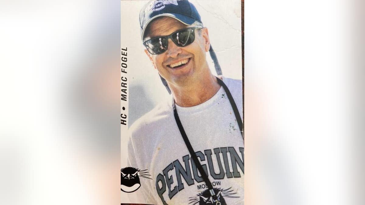 Marc Fogel smiling wearing a baseball cap and sunglasses