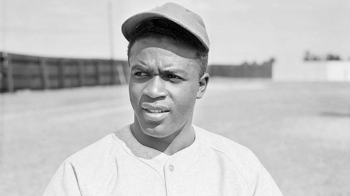 Jackie Robinson watching on the field