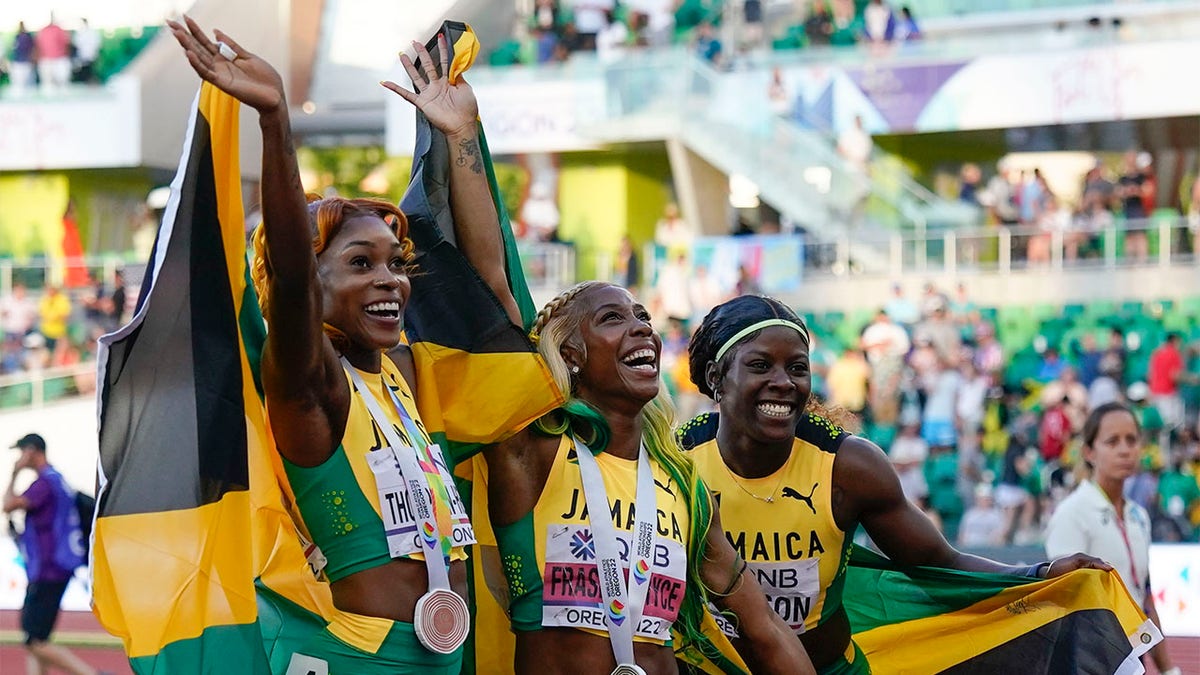 Shelly-Ann Fraser-Pryce, Shericka Jackson, and Elaine Thompson-Herah all wave to crowd