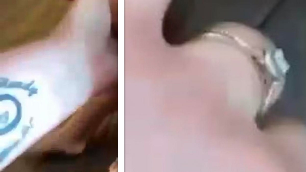 Screengrabs from the video show the tattoo and a ring