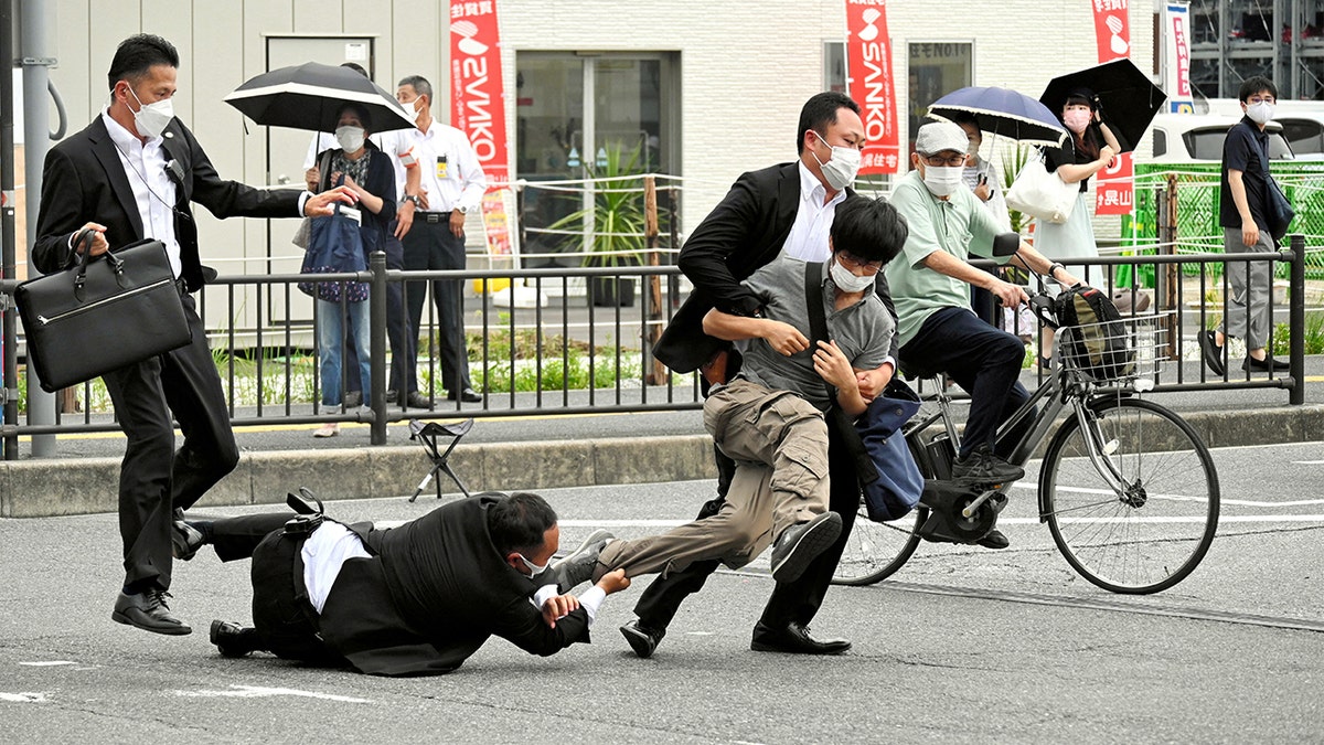 Shinzo Abe shooting suspect is taken down by police officers