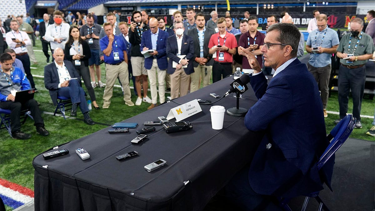 Jim Harbaugh speaks to reporters