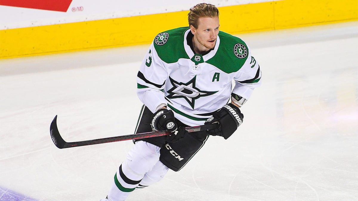 John Klingberg skates on the ice