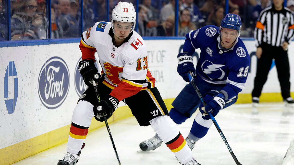 Johnny Gaudreau skates with puckth p