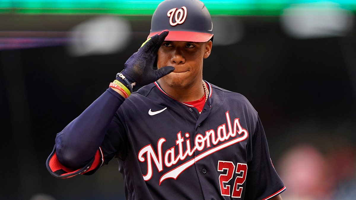 Juan Soto gestures to his dugout