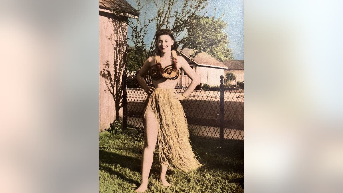 June Malicote in grass skirt