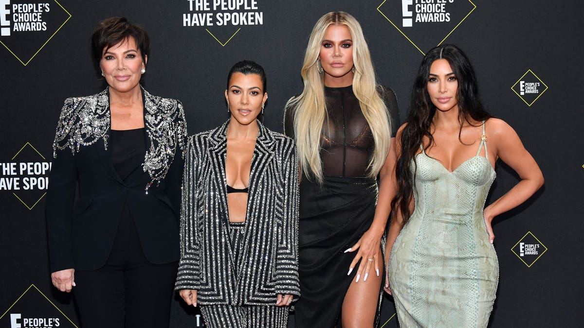 The Kardashians and Kris Jenner pose for a photo