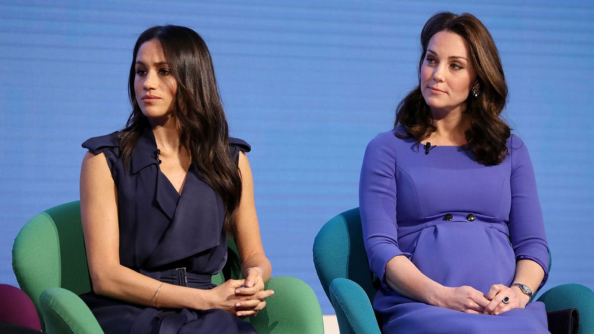 Kate Middleton sitting next to Meghan Markle pregnant