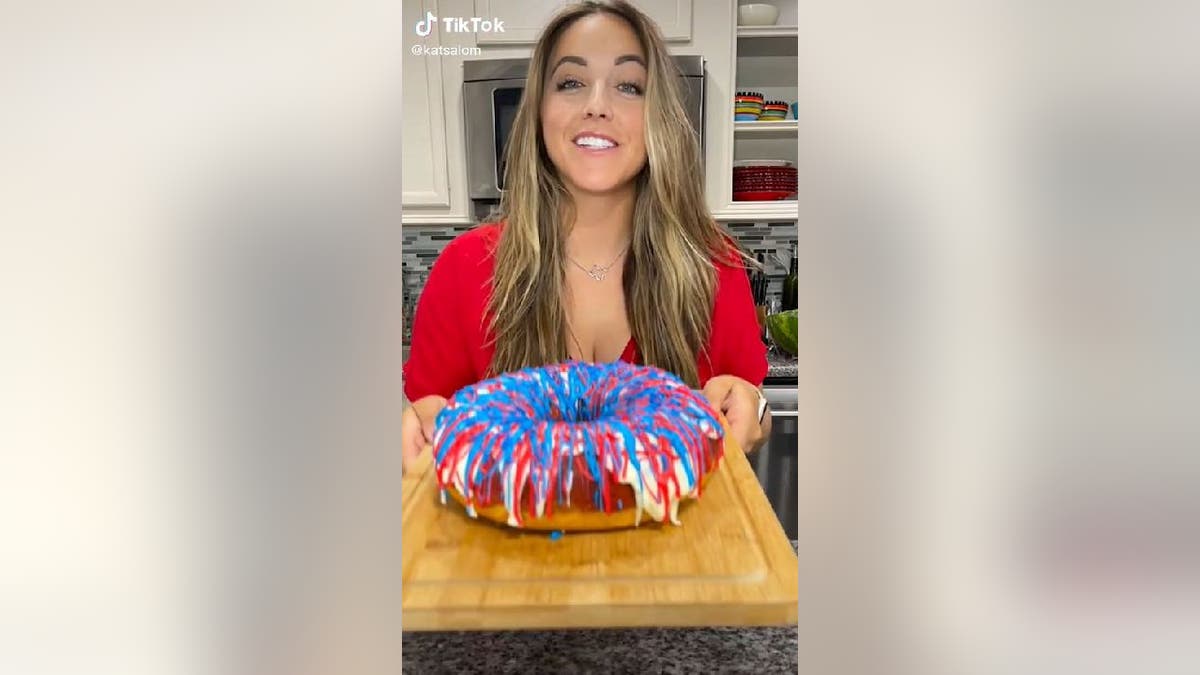 Katherine Salom holds up 4th of July bundt cake