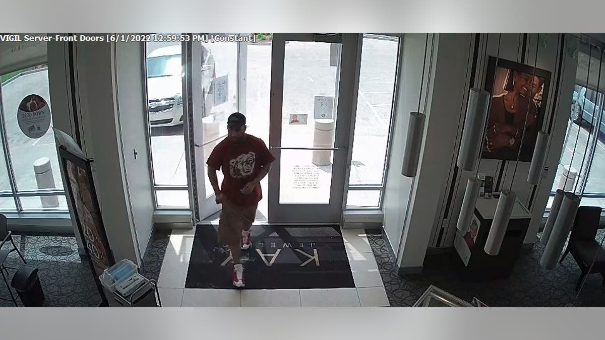 Surveillance footage of man entering Kay Jewelers