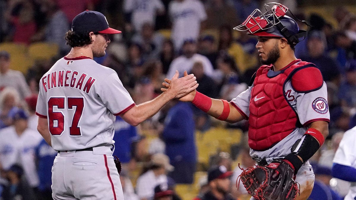 Kyle Finnegan celebrates with Keibert Ruiz