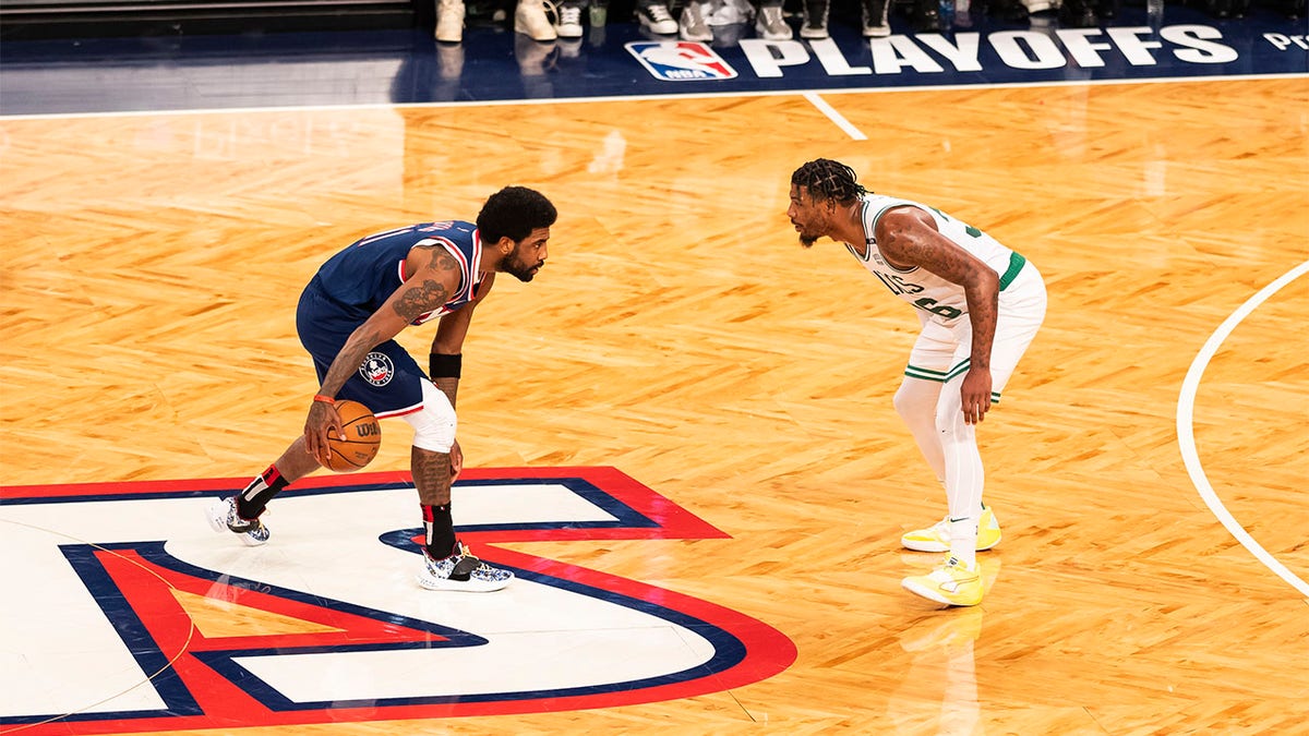 Kyrie Irving dribbles the basketball