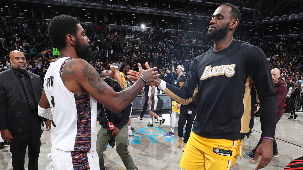 LeBron and Kyrie Irving shake hands