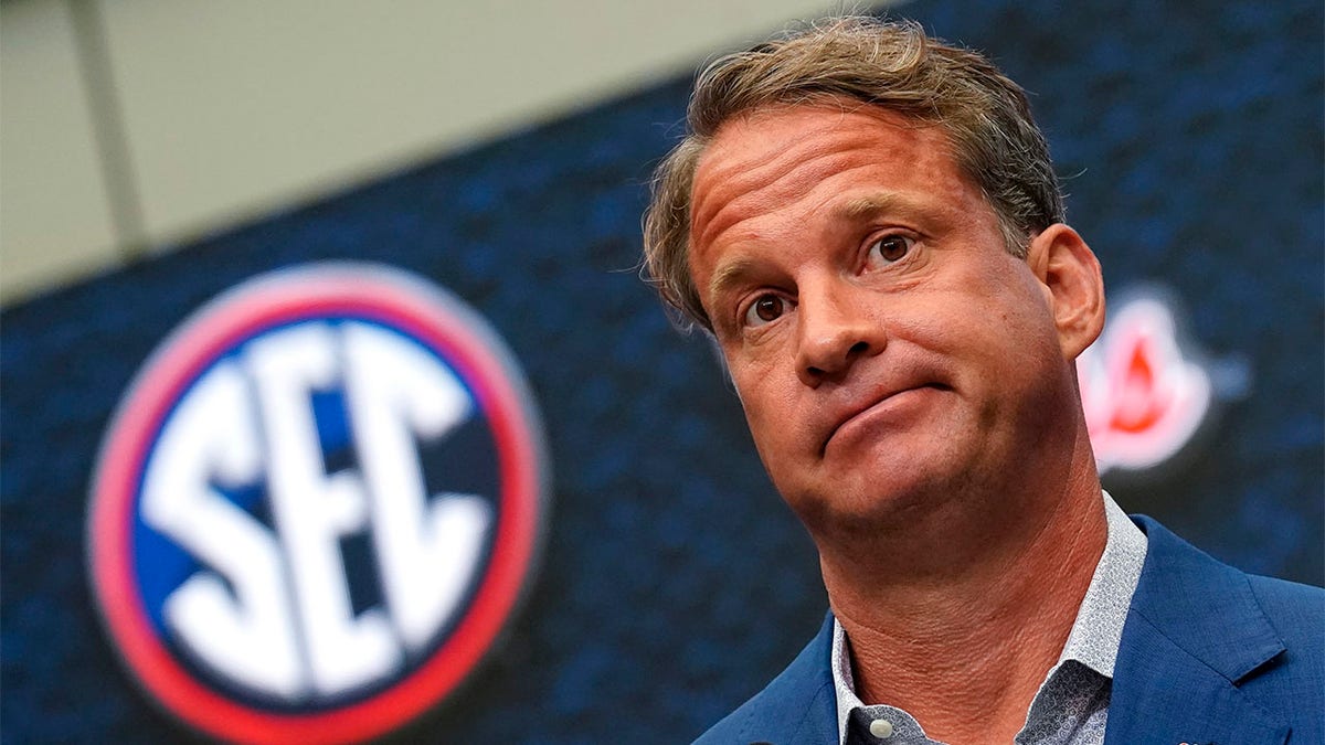 Lane Kiffin looks on during SEC Media Day