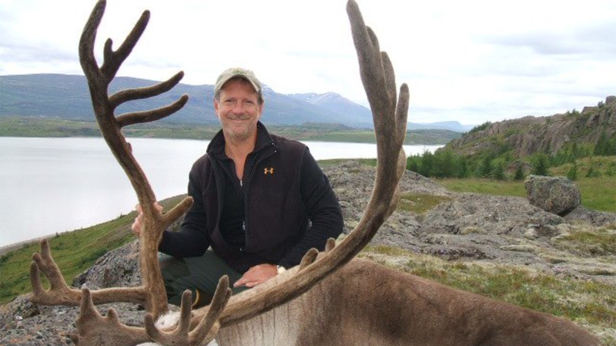 Lawrence Rudolph posing with an elk