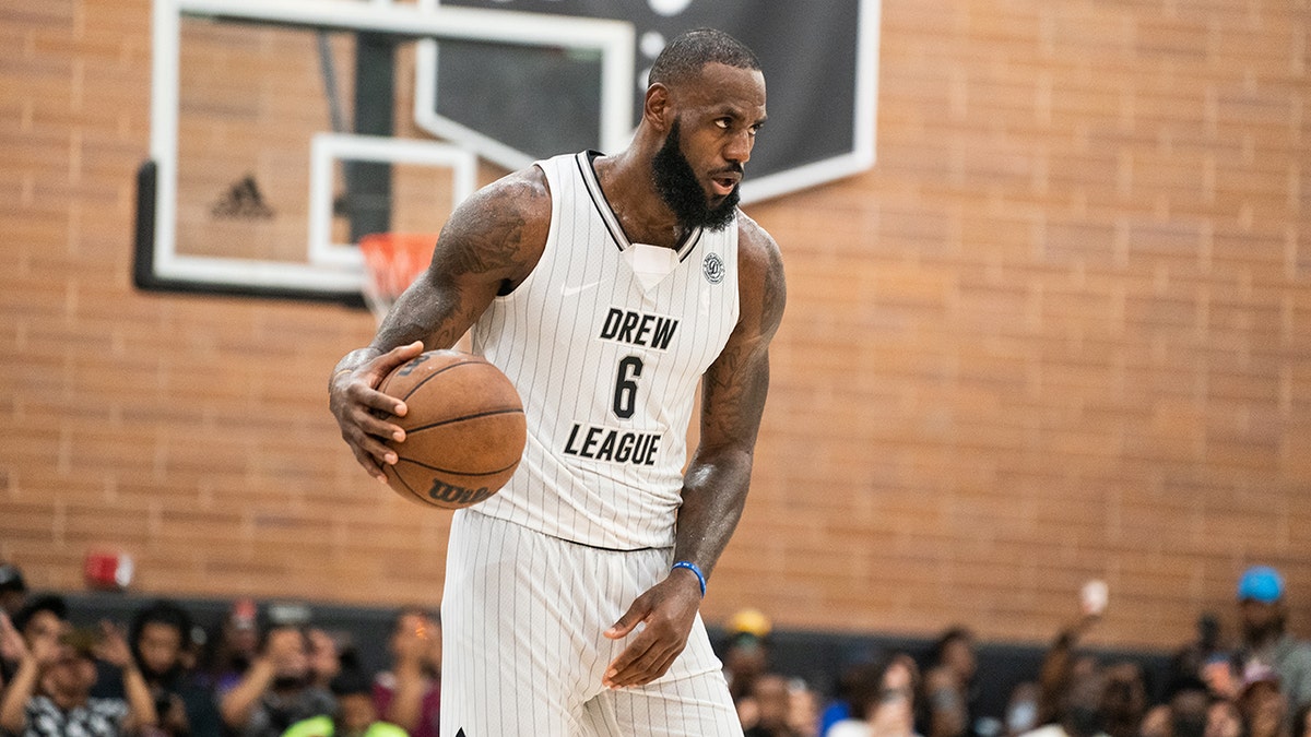 LeBron James handles the ball at the Drew League