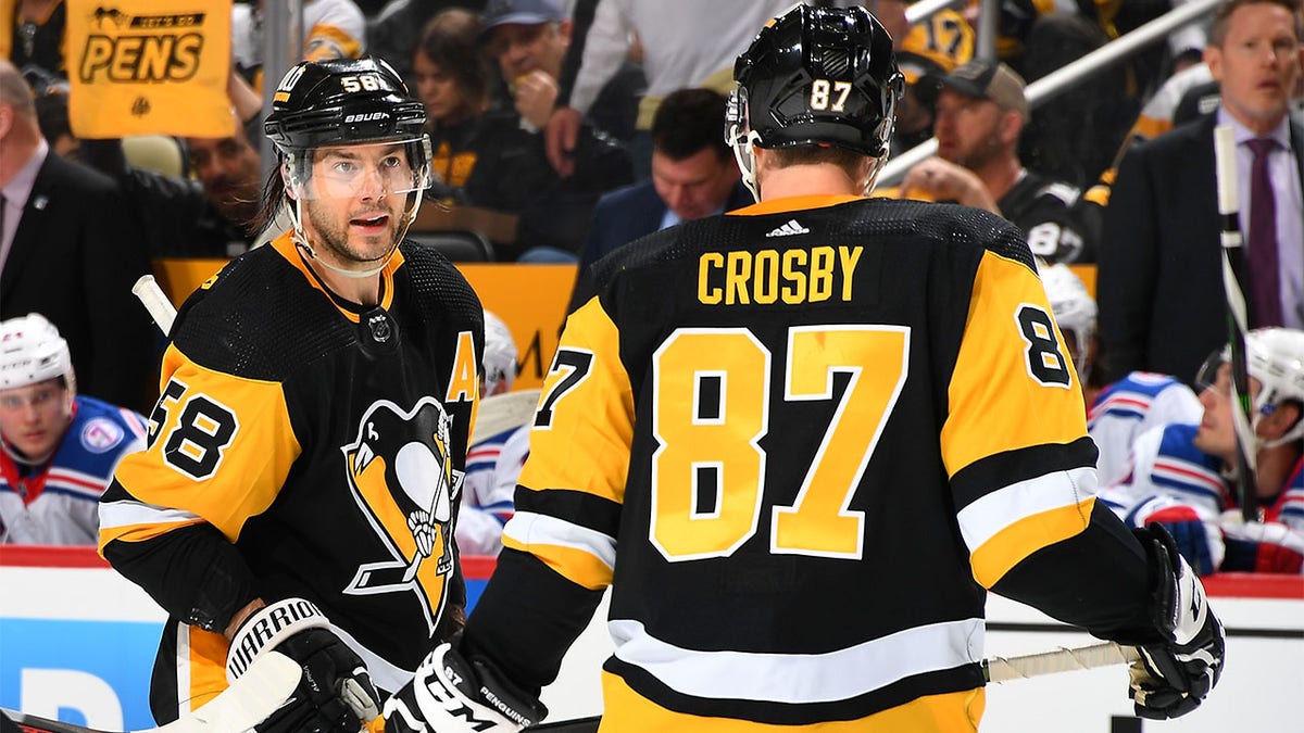 Kris Letang talks to Sidney Crosby