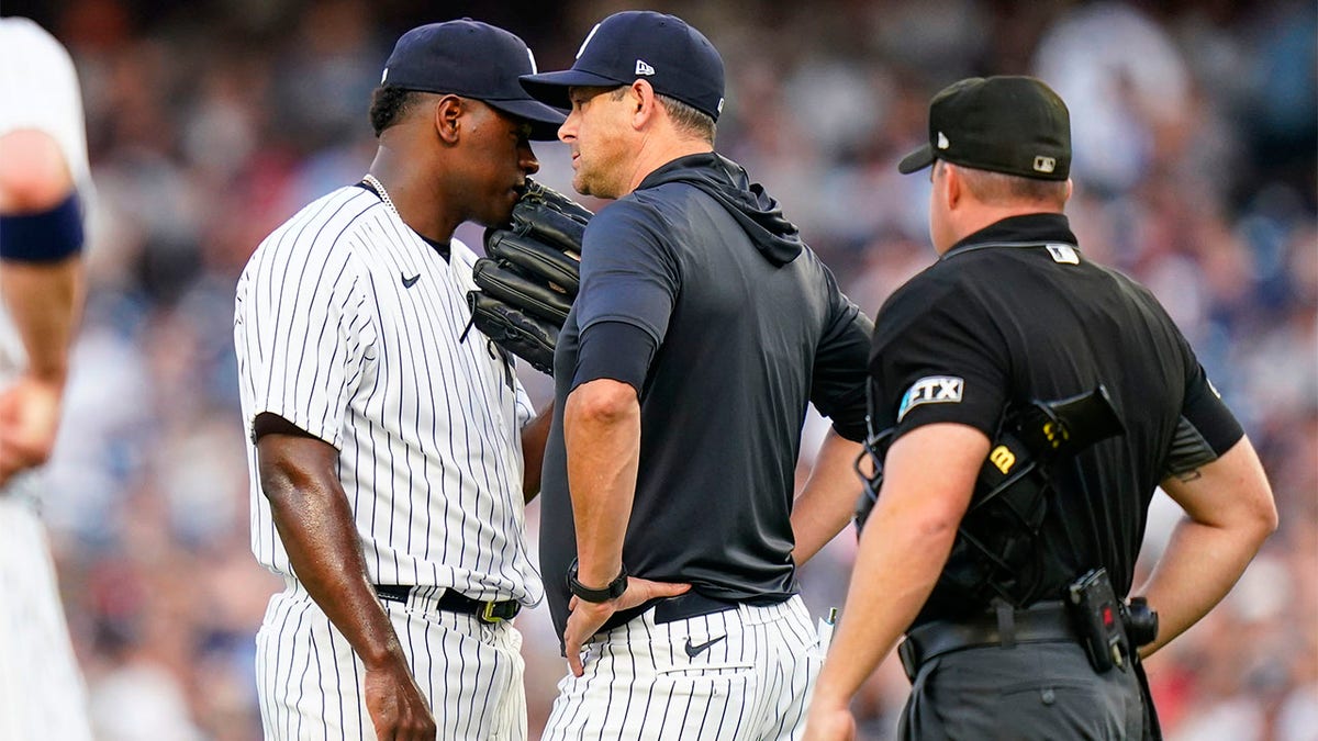 Luis Severino talks with Aaron Boone