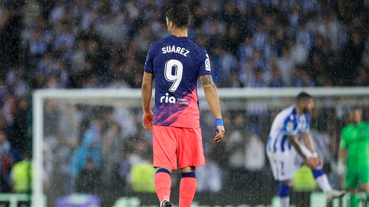 Luis Suarez walks on the field