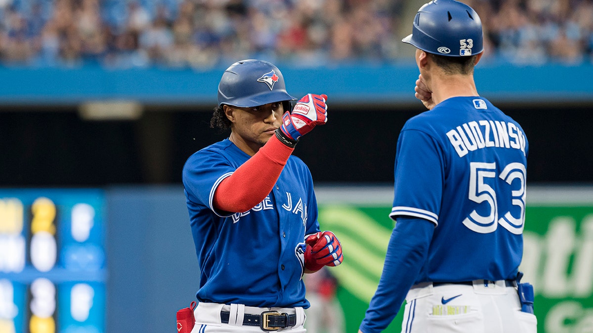 Mark Budzinski with a Blue Jays player