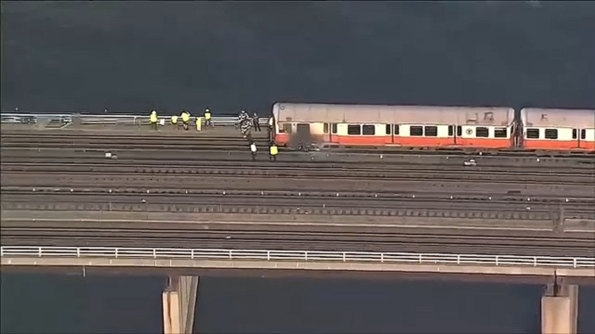 Massachusetts train that caught fire is seen from the air