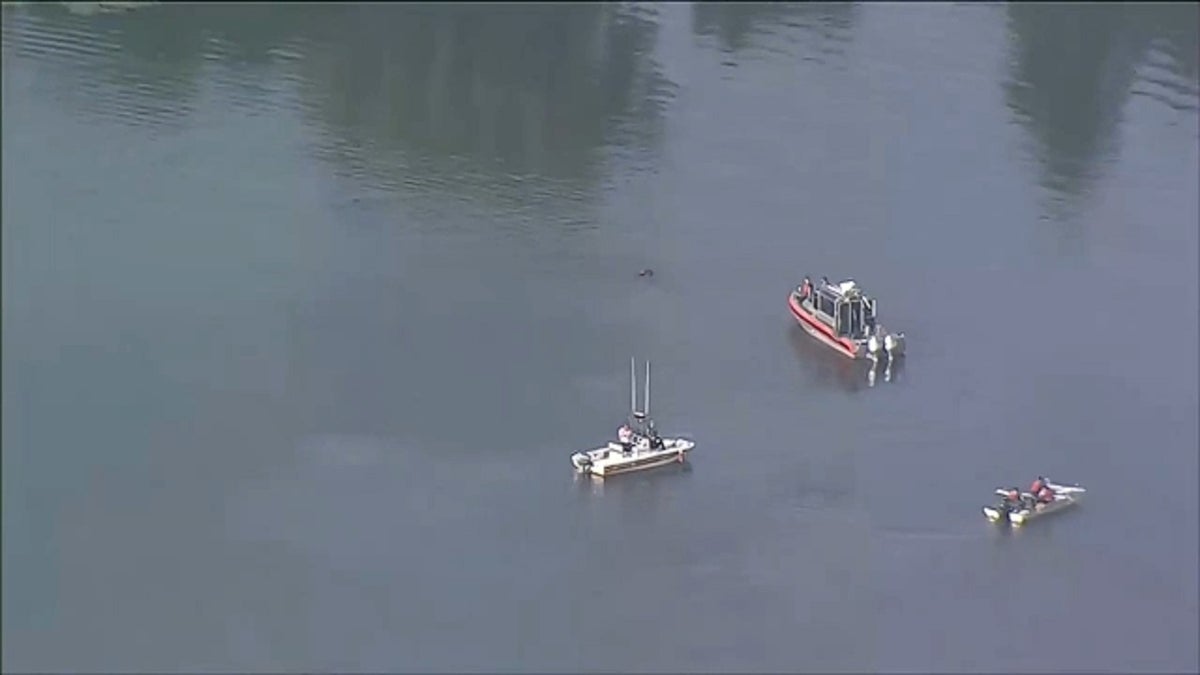 First responders search Mystic River after Massachusetts train catches fire