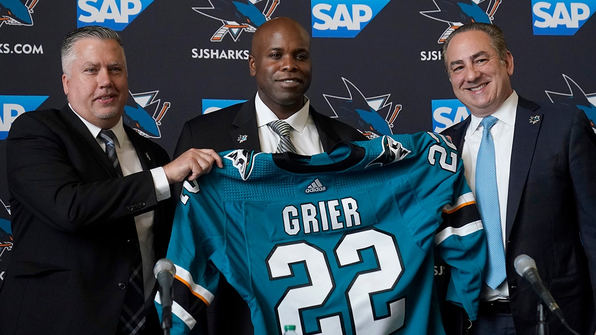 Mike Grier receives a Sharks jersey