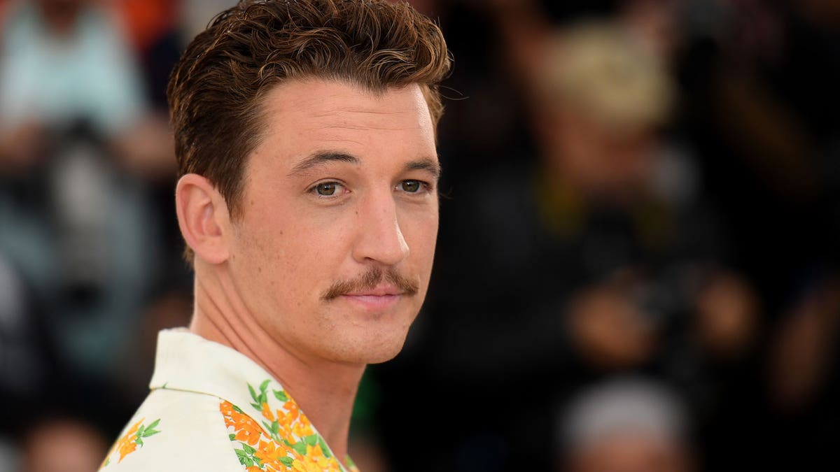 Miles Teller appears at a photocall