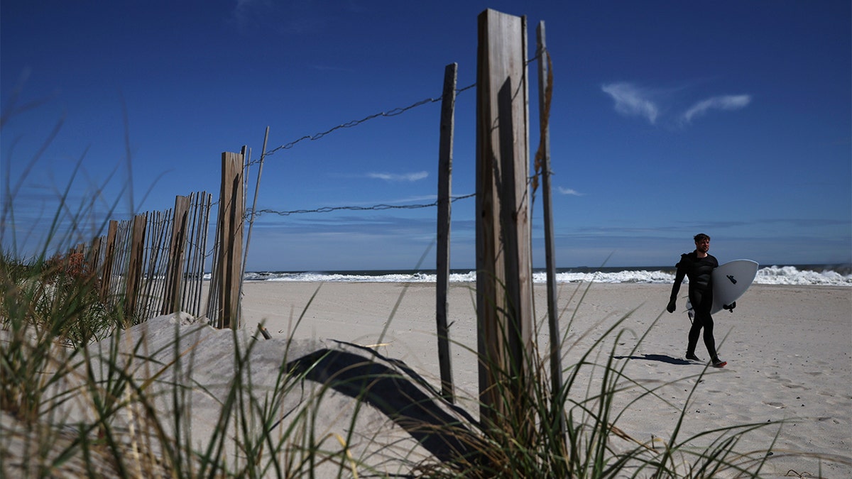 Surfer on a New York beach in May