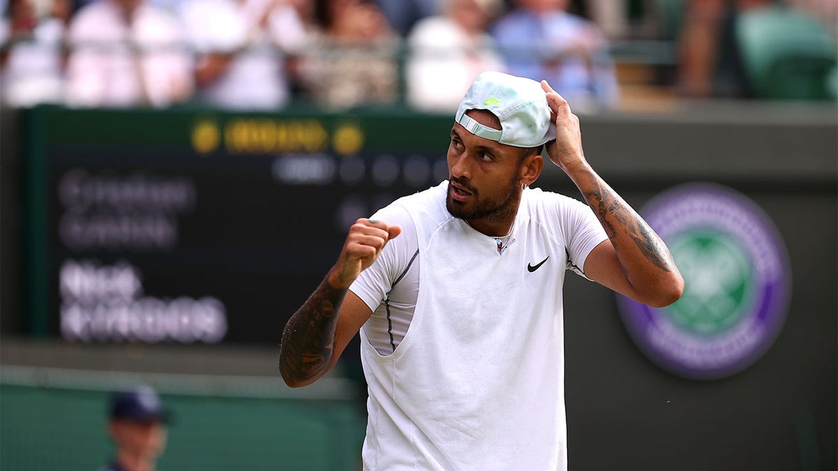 Nick Kyrgios celebrates winning the match against Cristian Garin