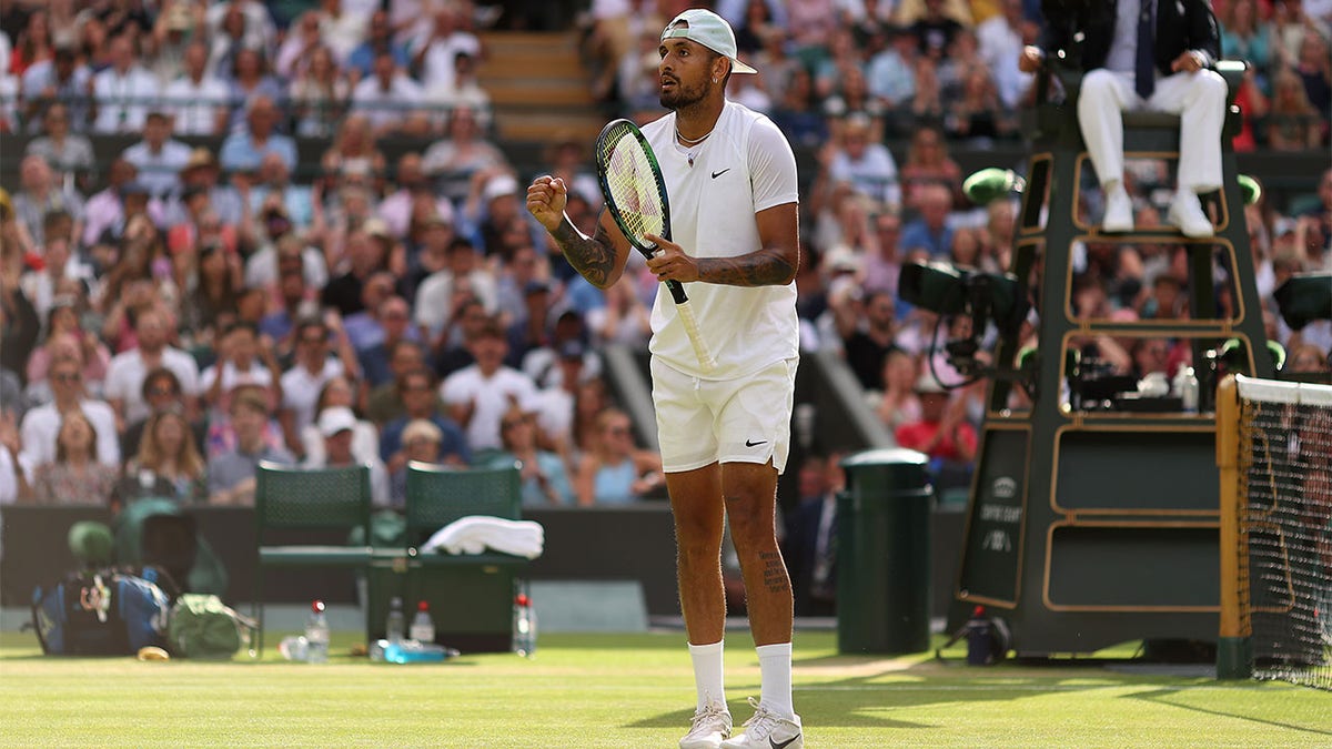 Nick Kyrgios celebrates winning his match