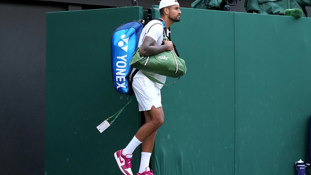Nick Kyrgios steps onto the court at Wimbledon 2022