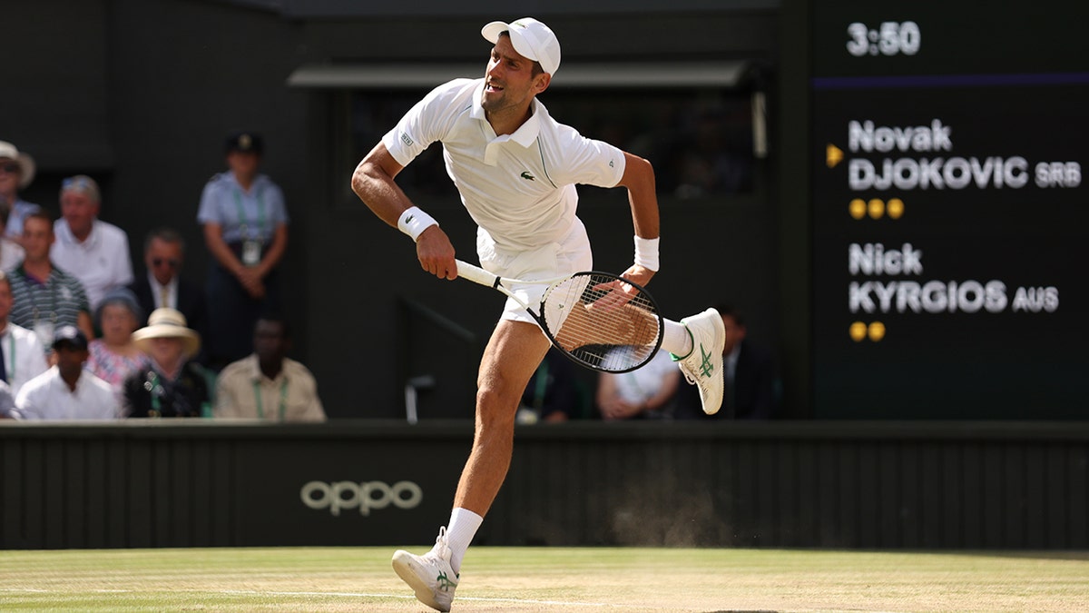 Novak Djokovic returns a shot from Nick Kyrgios