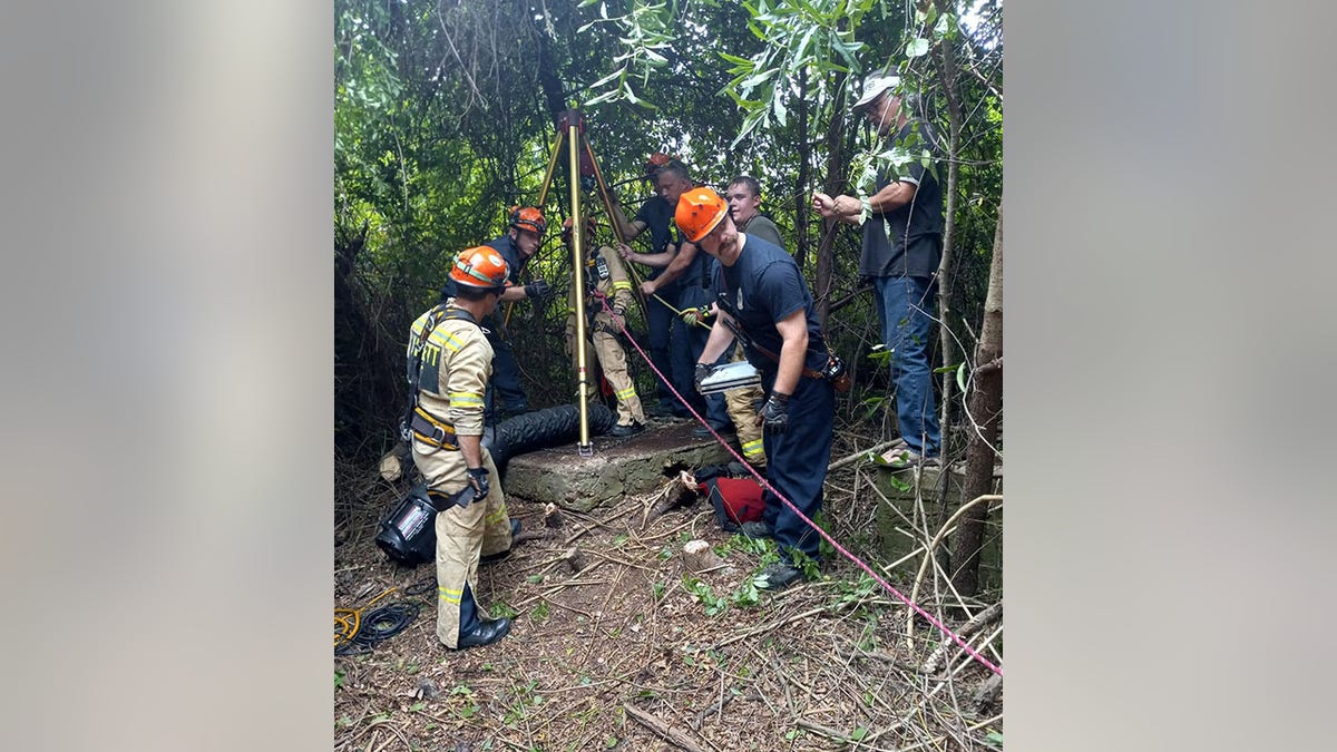 Oconee County Fire Rescue work to recue dog trapped in well