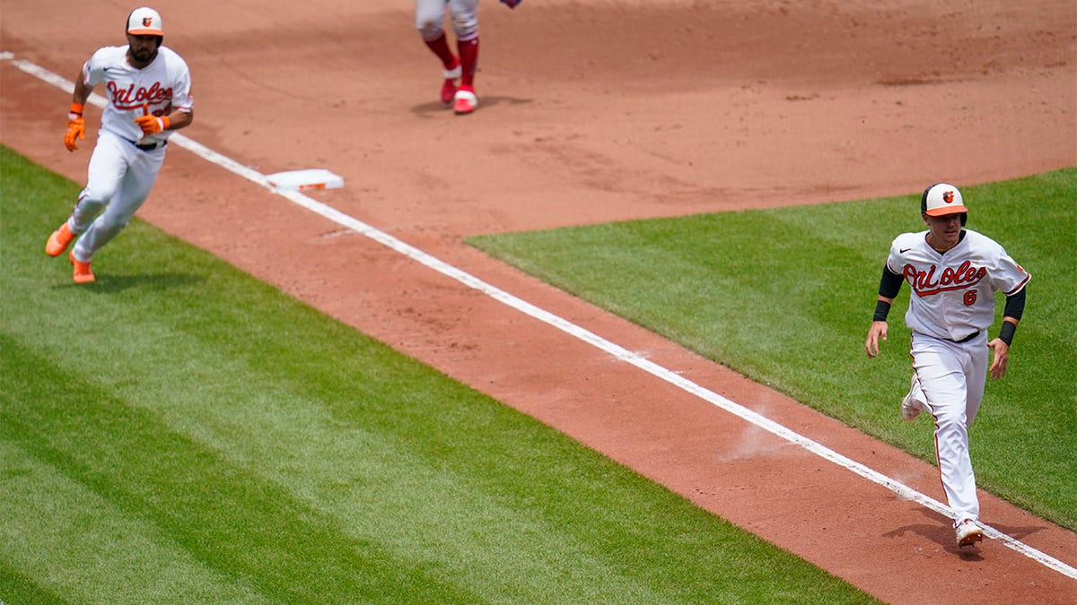 Ryan Mountcastle and Anthony Santander run home