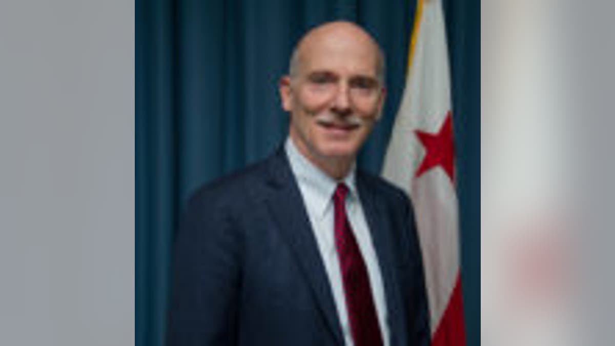Council Chairman Phil Mendelson photo with DC flag in background