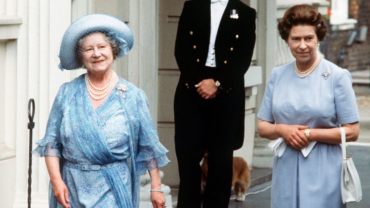 Queen Mother and Queen Elizabeth II walk in London.