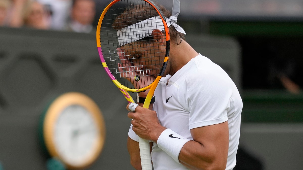 Rafael Nadal wipes the sweat away