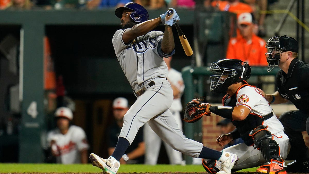 Randy Arozarena follows through on baseball